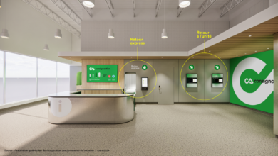 Reception area with express return and unit return kiosks in a modern lobby, near an information desk and branding signage on the wall