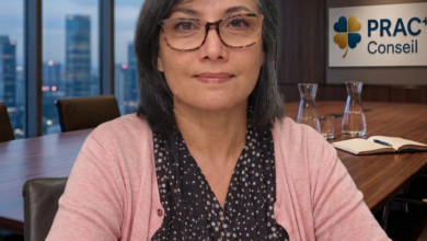 Professional woman with glasses seated at a conference table in a meeting room, PRACT Conseil sign in background.