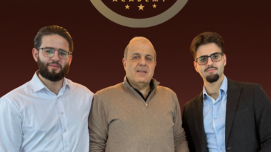 Three men stand in front of a gold ADDAS Academy crest on a burgundy gradient background.